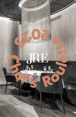 JRE Chef's Roulette 2025 Elegant restaurant table setting under modern chandelier for JRE Chef's Roulette 2025
